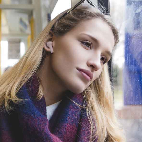 Girl on bus with JVC earphones