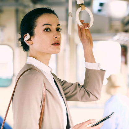 Lady wearing nearphones HA-NP35T on bus